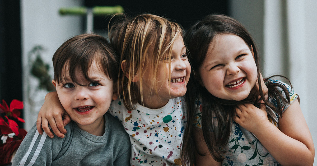 Boy holding a model of a set of teeth